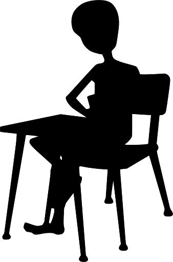 Child Sitting at a School Desk