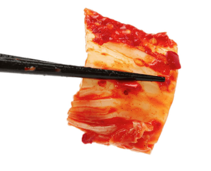Chopsticks Holding A Piece Of Kimchi