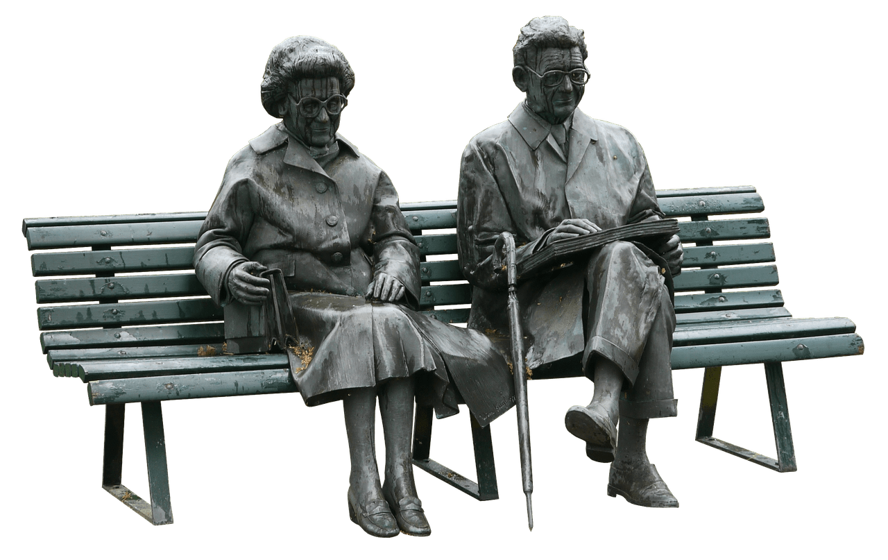 Couple Old People Sitting on A Bench Statue