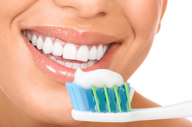 Toothpaste on Brush Near Face